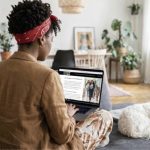 Home buyer looks at Michelle Elliott's website for a new home
