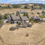 Distant view of custom home on private hilltop lot in San Jose California.