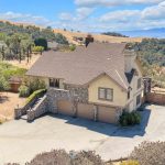 Rear exterior of multi-level home on hillside lot in San Jose California.