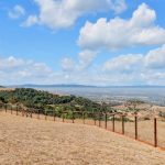 Fenced perimeter of large acreage lot in prestigious San Jose foothills.