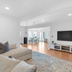 Open concept living area with TV lounge setup in luxury San Jose estate.