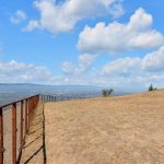 Fenced open lot boundary on scenic San Jose foothill property.