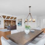 Formal dining space with wooden table and chairs in modern San Jose CA luxury property.