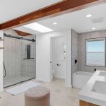 Master bathroom suite with double vanity, walk-in tile shower, and soaking tub in San Jose home.
