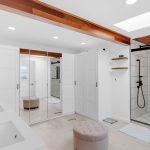 Master bathroom showing custom walk-in shower, soaking tub, and vanity in San Jose estate.