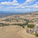 Drone shot of 5-bedroom luxury estate nestled in San Jose California foothills.