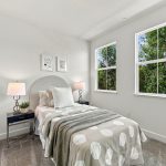 Bedroom with two windows, carpet and ceiling fan at 646 Luna Park Drive