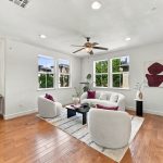 Open living and dining space with hardwood flooring